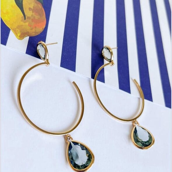Golden Teardrop Hoop Earrings featuring 18k gold-plated hoops with green teardrop-shaped gemstones