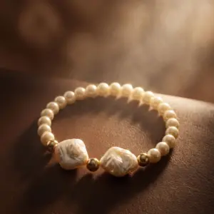 "Baroque Pearl Harmony Bracelet featuring round pearls, natural baroque pearls, and gold-tone accent beads."