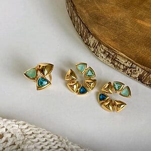 Golden Geo Gem Earrings and Ring featuring 18k gold-plated triangular shapes with green and blue faceted gemstones