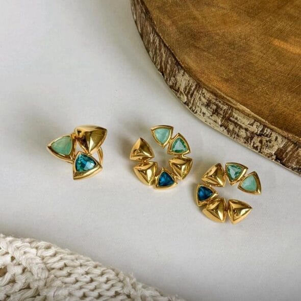Golden Geo Gem Earrings and Ring featuring 18k gold-plated triangular shapes with green and blue faceted gemstones