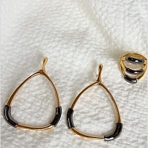 Golden Noir Statement Set featuring 18k gold-plated teardrop earrings and matching ring with black enamel accents
