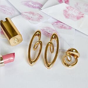 Golden Heart Swirl Set heart-inspired swirl earrings with matching sculptural ring, 18k gold plated.
