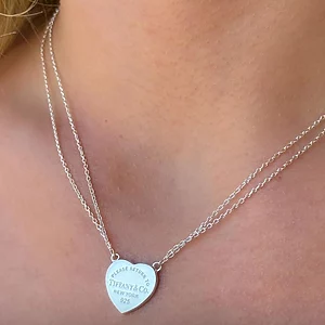 Silver Heart Pendant Tiffany necklace with Tiffany-style engraving and double chain design.