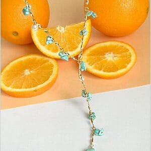Turquoise And Pearl Drop Necklace is a Gold chain necklace with turquoise chips and pearl drops, handcrafted boho-chic design