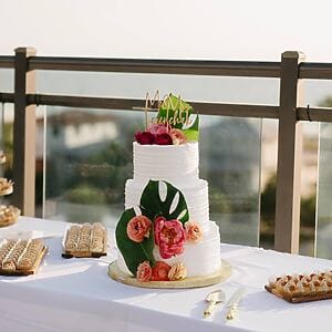 Custom wedding cake with elegant, handcrafted decorations from Karamelado Cakes & Pastries in Clearwater