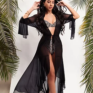 Long black sheer beach cover‑up with flowing silhouette by Fashion Brasil Sun and Sea, Brazilian resort wear.
