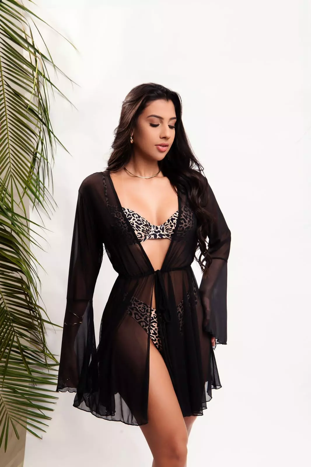 Short black sheer beach cover‑up with front tie by Fashion Brasil Sun and Sea, Brazilian resort wear.