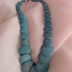 Handmade flat bead statement necklace by Fashion Brasil Sun and Sea, available in four colors.