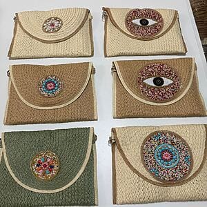 Hand‑embroidered artisanal purse with colorful beadwork by Fashion Brasil Sun and Sea, woven summer bag.