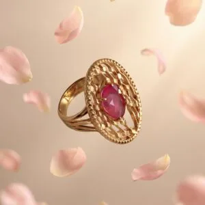 Gold ring with pink sapphire center stone surrounded by delicate details, symbolizing love and a meaningful Mother’s Day jewelry gift.