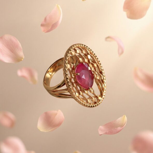 Gold ring with pink sapphire center stone surrounded by delicate details, symbolizing love and a meaningful Mother’s Day jewelry gift.