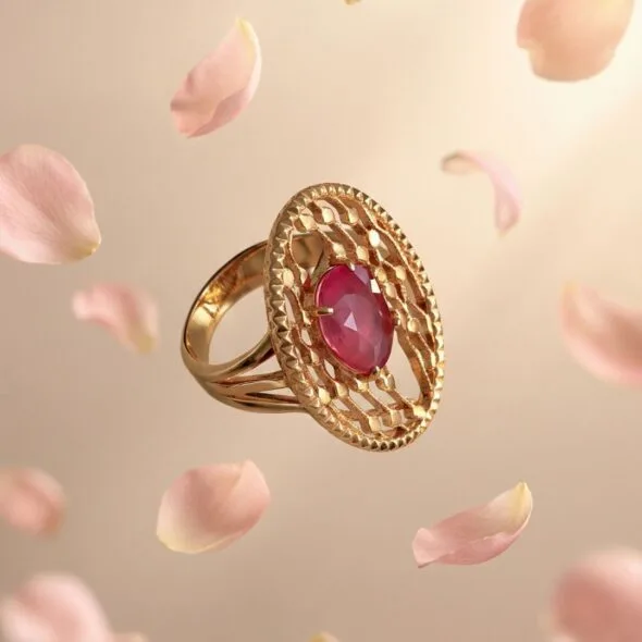 Gold ring with pink sapphire center stone surrounded by delicate details, symbolizing love and a meaningful Mother’s Day jewelry gift.