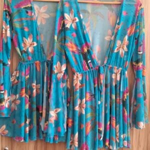 Blue tropical floral short beach cover‑up with lightweight flowy fit, Fashion Brasil Sun and Sea.