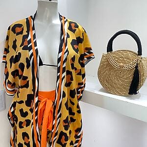 Two‑piece pareo set with printed beach cover‑up and matching bikini top, Fashion Brasil Sun and Sea.
