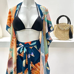 Tropical two‑piece pareo set with printed beach cover‑up and matching bikini top, Fashion Brasil Sun and Sea.