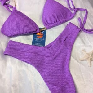 Purple textured Brazilian bikini with UV50+ protection and sophisticated finish, Fashion Brasil Sun and Sea.
