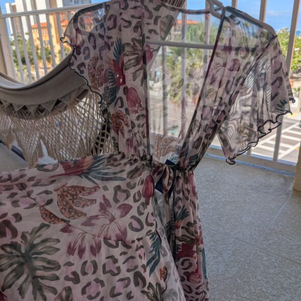 Short beach cover‑up with tropical floral and animal print, lightweight and flowy fit, Fashion Brasil Sun and Sea.