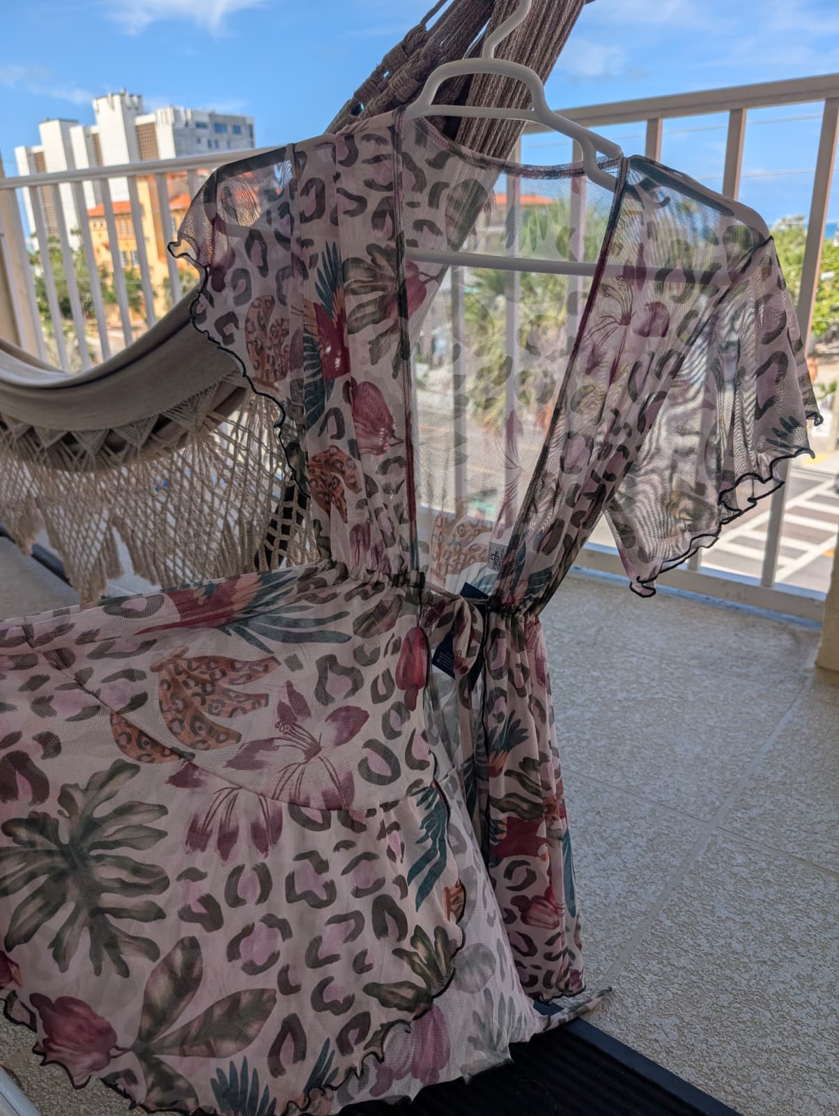 short beach cover up tropical print fashion brasil sun and sea | Animal Print Short Beach Cover‑Up – Fashion Brasil Sun and Sea Short beach cover‑up with tropical floral and animal print, lightweight and flowy fit, Fashion Brasil Sun and Sea.