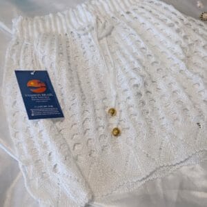 White crochet beach shorts with drawstring waist and gold detail, lightweight and breathable, Fashion Brasil Sun and Sea.