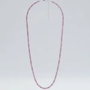 “Blush Shine Necklace by Madu Joia Rara featuring a delicate tennis chain with soft pink crystals and elegant feminine design.”