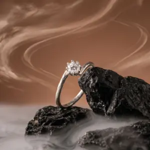 “Light Point Ring by Madu Joia Rara featuring a brilliant solitaire stone set in a polished minimalist band.”