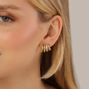 Mari Semijoias Golden Layers Hoop Earrings featuring a quadruple hoop design with sparkling zirconia accents and 18K gold plating