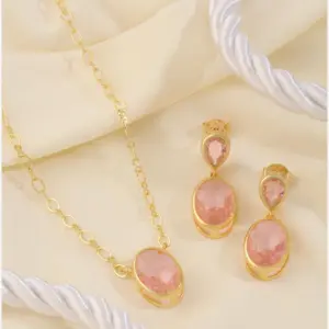 Pink Oval Jewelry Set by Mari Semijoias featuring a gold-tone necklace and matching earrings with blush pink oval stones