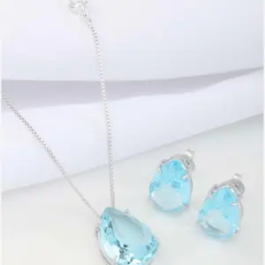 Light Blue Teardrop Jewelry Set by Mari Semijoias featuring matching necklace and earrings with sparkling light blue crystals
