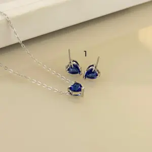 Mari Semijoias Royal Blue Heart Jewelry Set with matching heart-shaped zirconia necklace and earrings