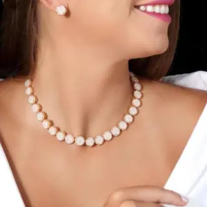 Mari Semijoias Champagne Luxe Jewelry Set with matching necklace and earrings featuring champagne beige stones and micro zirconias