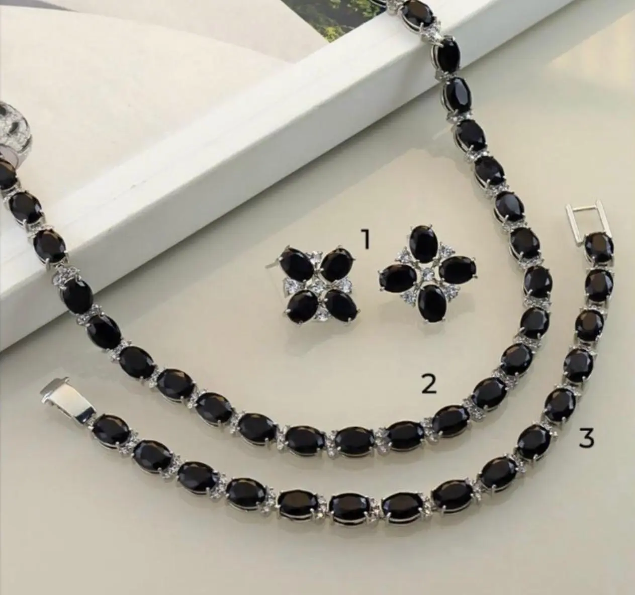 mari semijoias midnight onyx bloom earrings front | Midnight Onyx Bloom Earrings - Mari Semijoias Mari Semijoias Midnight Onyx Bloom Earrings with floral black stones and zirconia accents
