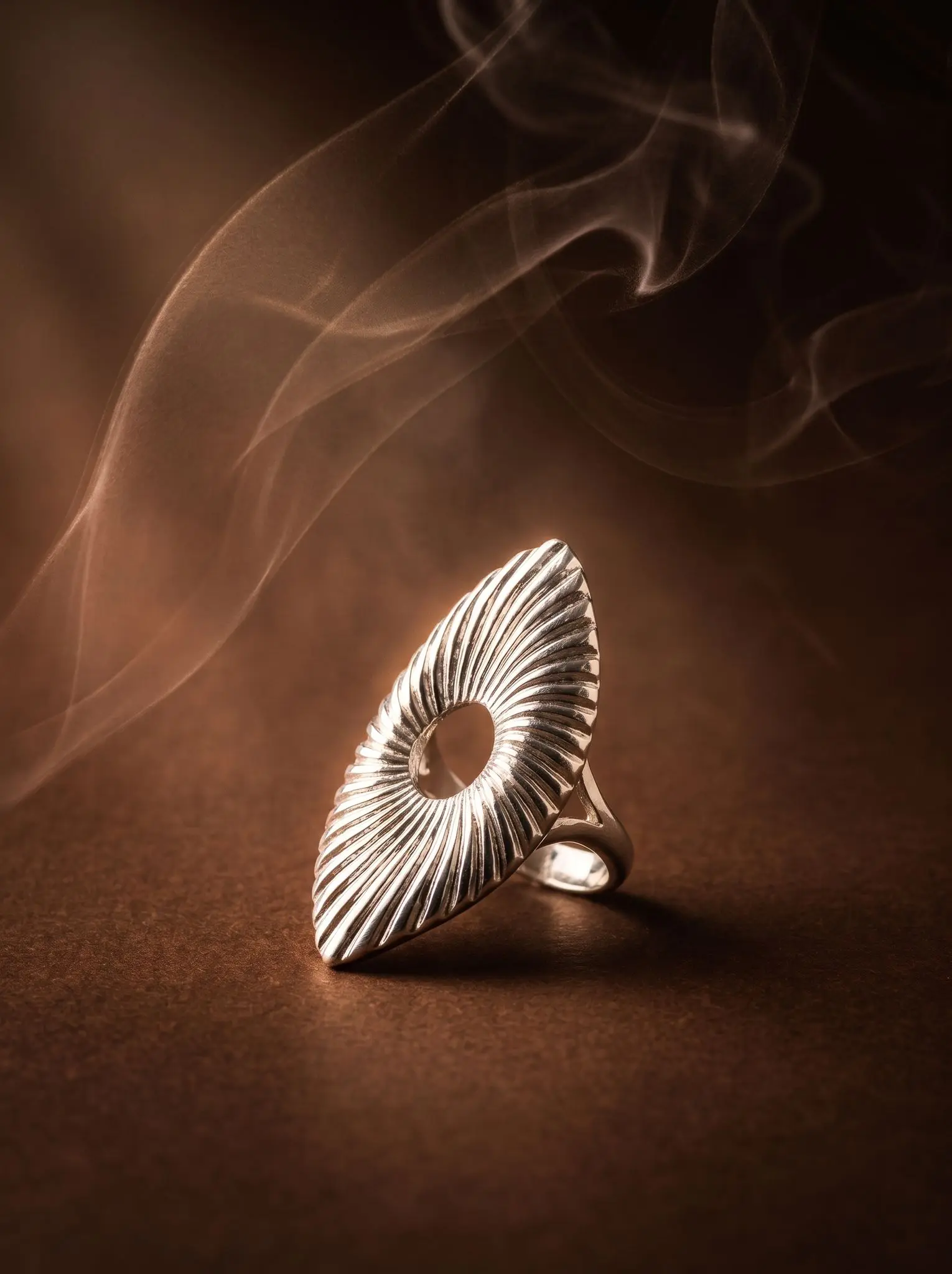 celestial wave ring madu joia rara silver | Celestial Wave Ring – Madu Joia Rara Silver-tone statement ring featuring a sculptural wave-inspired design with textured radiating lines and an open center detail, showcasing modern elegance and artistic craftsmanship by Madu Joia Rara.