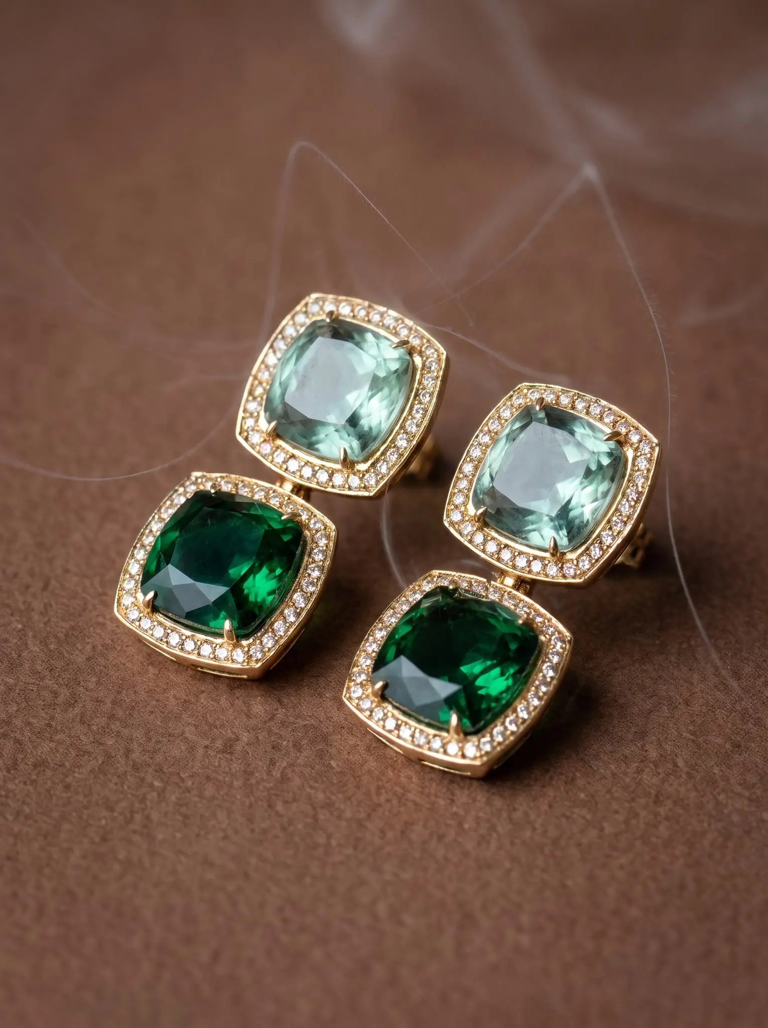emerald duality earrings madu joia rara | Emerald Duality Earrings – Madu Joia Rara Gold-tone drop earrings featuring emerald green and soft green faceted stones framed by sparkling zirconia halos, creating a sophisticated geometric design by Madu Joia Rara.